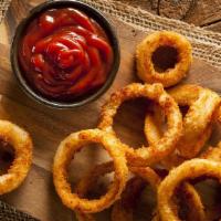 Bb'S Crispy Onion Rings · Basket of battered and deep fried onion rings