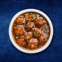 Gobi Manchurian · Cauliflower flowerets, seasoned, batter fried and sauteed with green onions and an Indo-Chin...