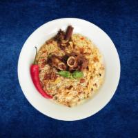 Goat Deluxe Biryani · Bone-in goat meat cooked in a special biryani masala curry, layered with imported long grain...