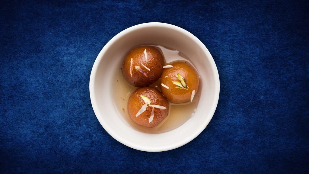Classic Gulab Jamun  · Village cheese dumplings deep fried and steeped in a cardamom infused sugar syrup