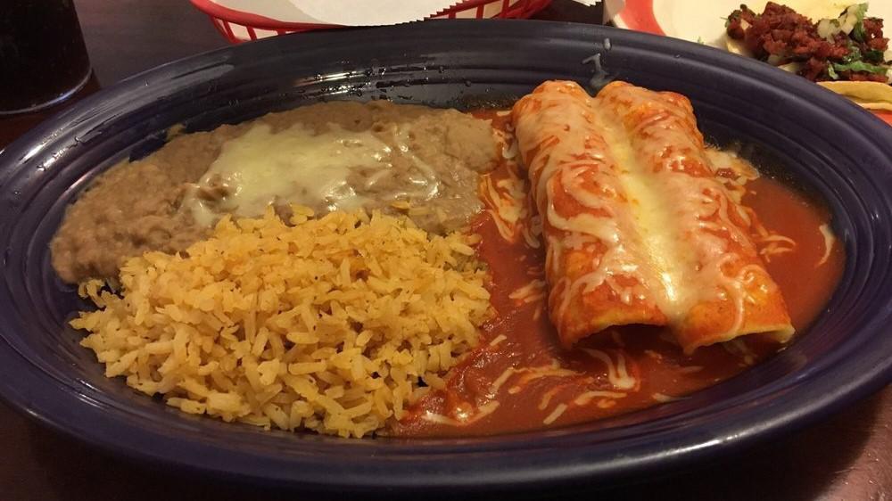 Enchiladas Mexicanas · 3 enchiladas on a red sauce, topped with lettuce, onion, radishes, fresh cheese,rice and beans.