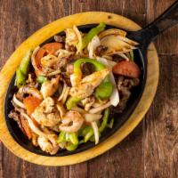 Vegetarian Fajitas · Sauteed mushrooms, onions, green peppers, and tomatoes. Served with rice and beans.