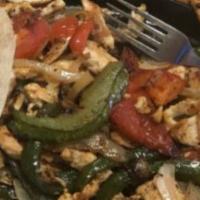 Chicken Fajitas · Served with guacamole, rice and refried beans.