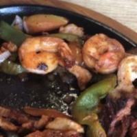 Shrimp Fajitas · Served with guacamole, rice and refried beans.