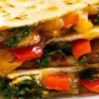Quesadillas · Steak or Chicken, cheese, pico, sour cream, and choice of garden salad or rice and beans.