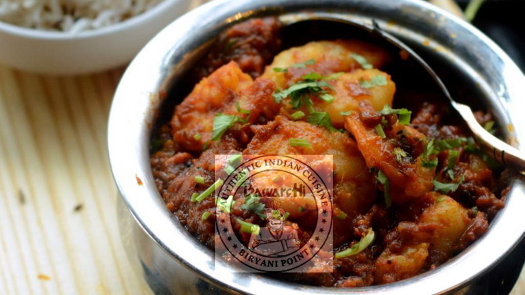 Shrimp Masala · Shrimp cooked in delicately ground spices with onions and tomato gravy.