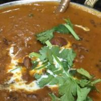 Dal Makhni · Black lentils blended with kidney beans cooked in a rich and creamy sauce topped with a gene...