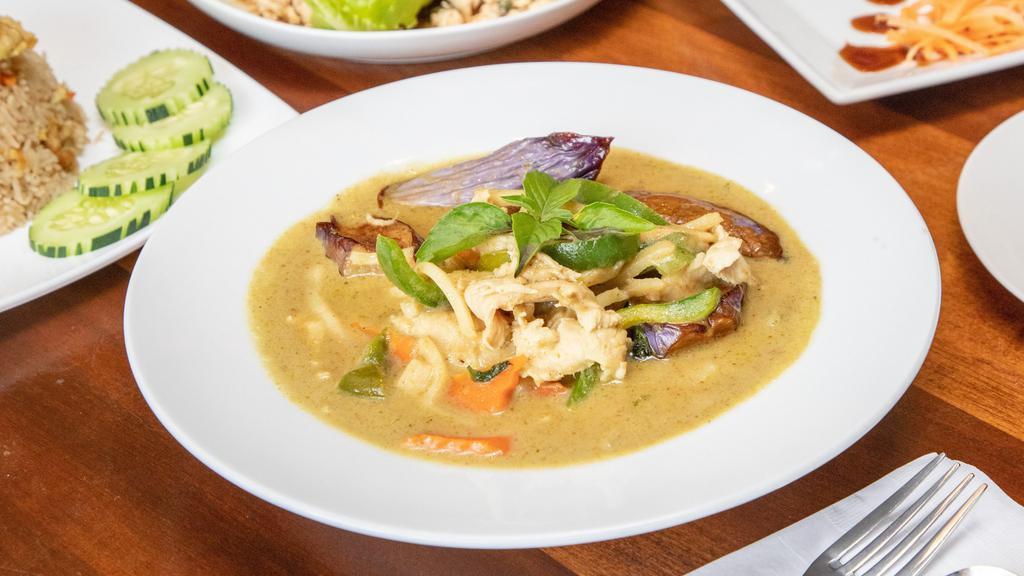 Green Curry · Green curry sauce mixed with eggplants, bamboo shoots, carrots, bell peppers & Thai basil leaves.