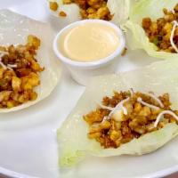 Lettuce Wrap · Choice of shrimp, chicken or fried tofu. Fresh water chestnuts and lettuce for wrapping, ser...