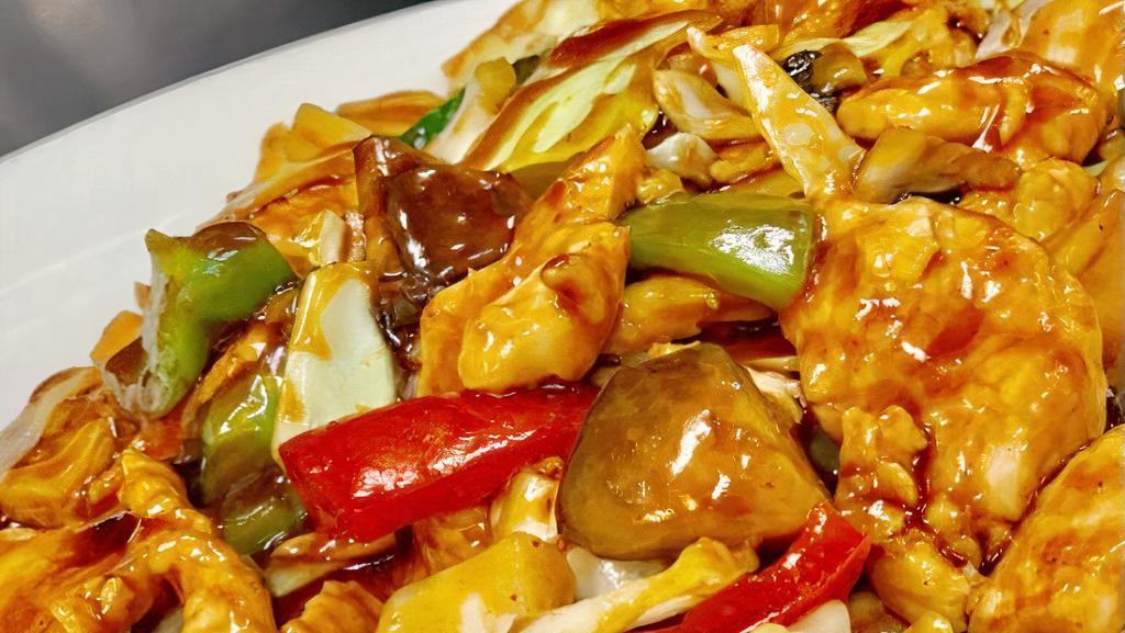 Spicy Thai Basil Chicken · Wok-fried sliced chicken with mushrooms, cabbage and bell pepper in a basil brown sauce.