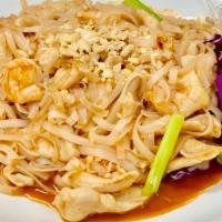 Pad Thai Noodles · Contains fish sauce. The taste of Thailand - sweet and spicy rice vermicelli sautéed with sh...