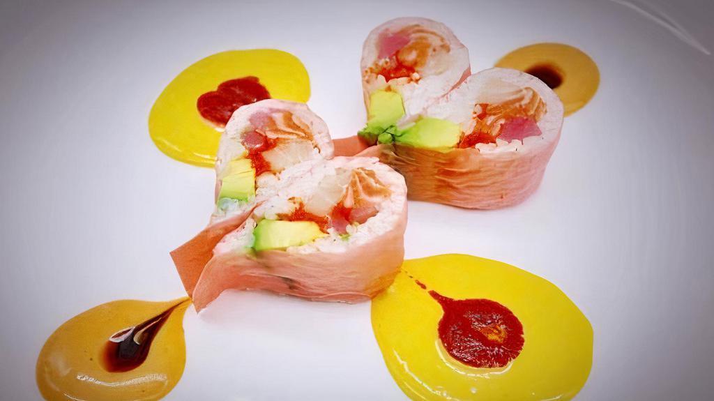Pink Lady Roll · 8 pieces. Raw. Tuna, salmon, yellowtail, avocado and masago wrapped in a heart-shaped soy wrap.