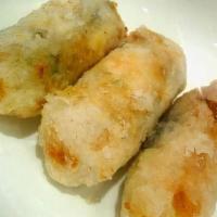 Shrimp Roll (1) · Savory shrimp filling wrapped in a paper thin wrapper and deep-fried.