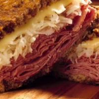 Mile High Corned Beef · Corned beef topped with sauerkraut, 1000 island dressing and  Swiss cheese.