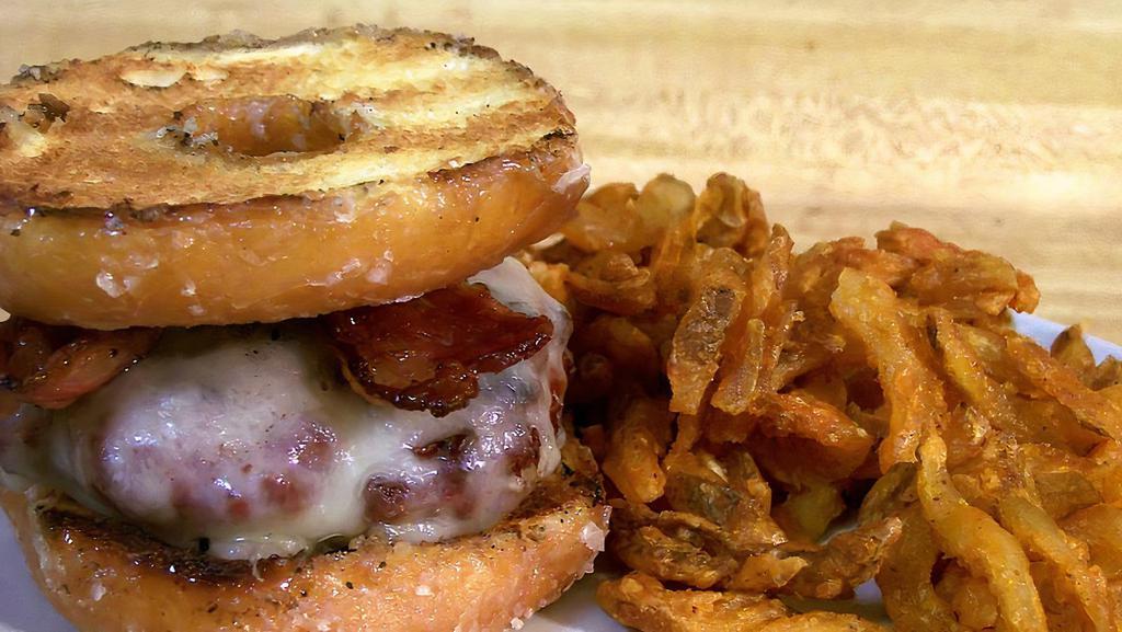 The Donut Burger · Fresh patty topped with American cheese on a grilled glazed donut.