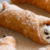 Cannoli (2) · Italian pastry filled with sweet chocolate chip ricotta filling topped with powdered sugar. ...
