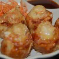 Crispy Pork&Shrimps Shumai · Juicy minced pork and shrimp shumai, seasoned with garlic oil and onion. Served with our hou...