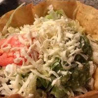Taco Salad · Crispy flour tortilla shell with choice of ground beef or chicken, beans, lettuce, tomatoes,...