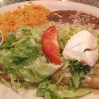 Chimichanga · Two flour tortillas filled with beef or chicken, then deep-fried and topped with melted chee...