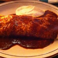 Burrito California · A burrito stuffed with beans, cheese, sour cream, onions, and choice of chicken or beef. Top...