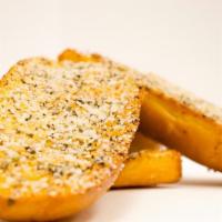 Garlic Bread · Hot bread baked with garlic butter, parmesan cheese, and herbs.
