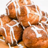 Cinnamon Knots · Fresh baked dough knots flavored with cinnamon & brown sugar. Served with creamy icing dip.