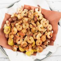 Famous Cajun Shrimp Boil Feast · Tender, succulent boiled Shrimp and fresh Red Potatoes. tossed with grilled Sausage and Corn...