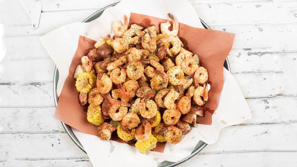 Famous Cajun Shrimp Boil Feast · Tender, succulent boiled Shrimp and fresh Red Potatoes. tossed with grilled Sausage and Corn, in house-made. Cajun Butter and our very own Cajun Seasoning blend.. Serves 4-6.