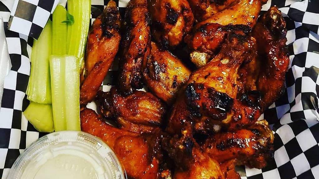Chicken Wings · Choose from: Hot, Medium, Mild, BBQ, Teriyaki, Cajun, Barbalo, Honey Mustard, Reaper, Lemon Pepper, Garlic-Parm, Teri-Hot, Honey Hot, Tangy Gold, Nashville Hot. All Flats or Drums Add an extra charge. Choice of Bleu Cheese or Ranch Dressing.