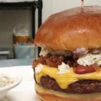 Carolina Burger · Chili, Coleslaw, American Cheese, Yellow Mustard, Red Onion.

This item may contain raw or u...