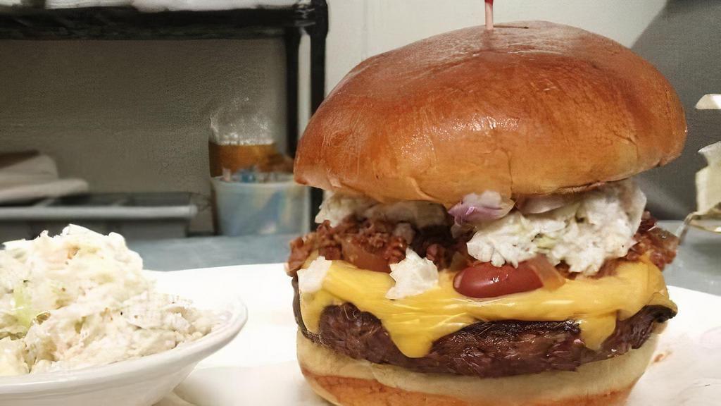 Carolina Burger · Chili, Coleslaw, American Cheese, Yellow Mustard, Red Onion.

This item may contain raw or undercooked ingredients. Consuming raw or undercooked MEATS, POULTRY, SEAFOOD, SHELLFISH, or EGGS may increase your RISK of foodborne illness.