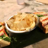 Cannnibal'S Club Sandwich · Turkey, ham, bacon, lettuce, tomato, mayo on sourdough.
Served with Chips