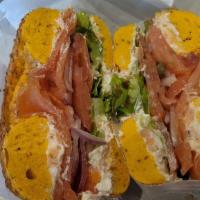 Bagel W/ Fresh Lox Deluxe · Bagel with lox spread and thin sliced smoked salmon, with Tomato, red onion, and capers.  Pl...