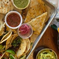 The Mockingbird Platter (Feeds 6 - 8 Hungry People) · serves 6-8 people
12 TACOS
• 6 tacos each of your choice
of any 2 varieties
2 QUESADILLAS
• ...