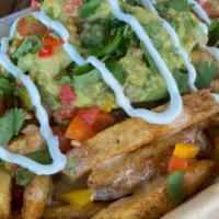 Loaded Nacho Fries · House-made fries dusted in chili powder and topped with quest, guacamole, cilantro, sour cre...