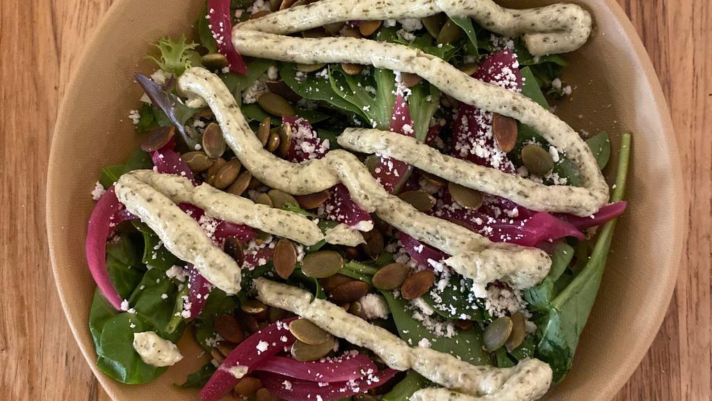 Side Salad · Fresh local greens, pickled onion, queso fresco, toasted pumpkin seeds and house vinaigrette on the side.  Vegetarian and gluten free.  Can be made vegan