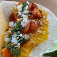 Smoked Carrot Taco · Smoked carrot from 5 Acre Farms, carrot puree, cilantro-peanut pesto, diced onion, and cotij...