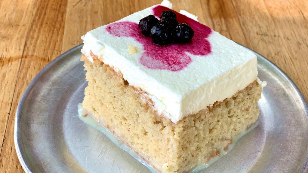 Tres Leches Cake · Fluffy cake soaked in 3 milks, topped w/house maraschino cherries