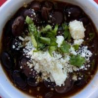 Side Black Beans · Blended Central American red beans topped with queso fresco  4-oz (vegetarian)