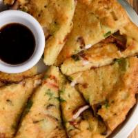 Hamul Pajeon - Seafood Pancake · Korean style pancake with shrimp, clams, mussels, squid, baby octopus, scallions and onions.