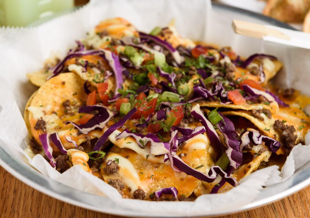 Gogi Nacho · Tortilla chips, drizzled with gogi sauce blend, topped with three types of cheese and beef bulgogi.