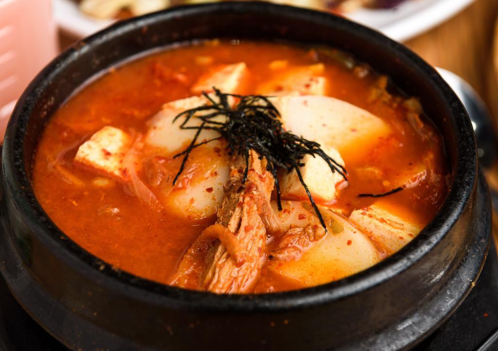 Kimchi Jigae - Kimchi Stew · Spicy kimchi stew with tofu, vegetables and pork.