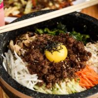 Bibimbap - Stone Pot Rice · Rice topped with vegetables and egg in a sizzling stone pot in your choice of flavor.