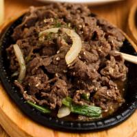 Bulgogi -Marinated Beef Ribeye · Thinly sliced beef rib eye marinated in our homemade sauce.
