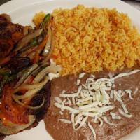 Steak Ranchero · Ribeye steak with ranchero sake on top served with rice, bean, and corn or flour tortillas.