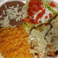 Pollo Con Crema · Cooked with bell pepper, onions, tomatoes, sour cream, served with rice, beans, and corn or ...