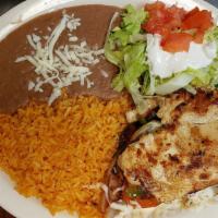 Pollo Con Chipotle · Cooked with bell pepper, onions, tomatoes, sour cream, chipotle sauce, served with rice, bea...