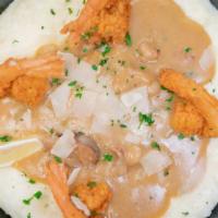 Southern Fried Shrimp N Grits · White truffle cheddar stone ground grits topped with crab crawfish gravy and jumbo fried shr...