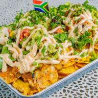 Macho Nachos · Fully loaded South African nachos, stacked with homemade seitan 