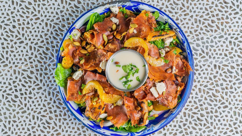 Heritage Salad · The delicious salad is a true celebration of our South African culinary heritage. Warm roasted butternut squash, creamy chevre, S.A biltong, preserved figs, red onion, mixed greens, toasted pumpkin & sunflower seeds drizzled in our heritage dressing.